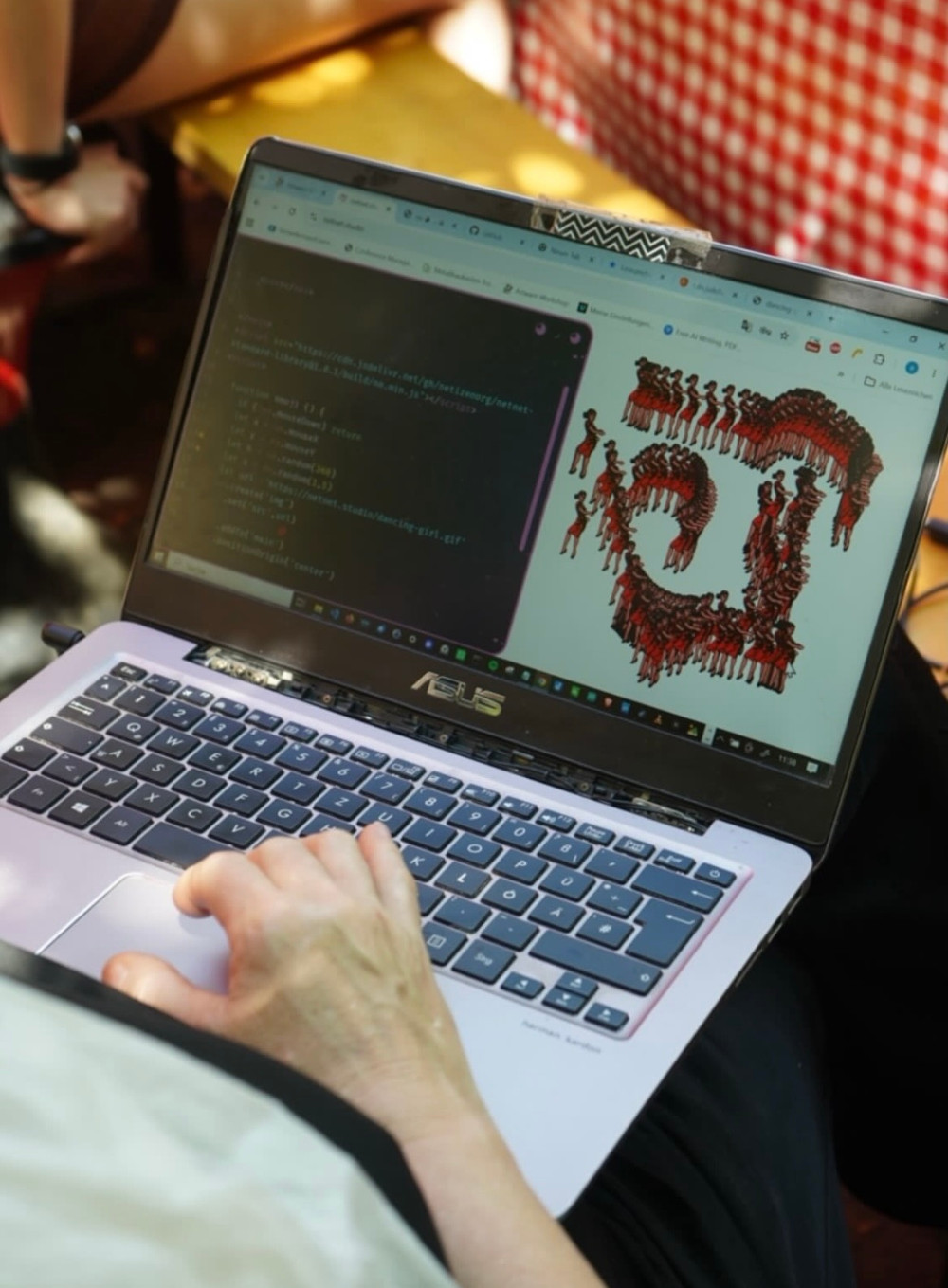 a student using netnet on their laptop, working on GIF drawing app in a garden in Nevers France as part of the NO SCHOOL program